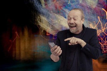 Wall Mural - Cheerful, bearded, white man is talking on phone.