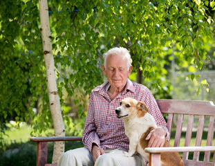 Wall Mural - Old man with dog in garden