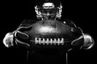 © Mike Orlov - Sport concept. American football sportsman player on black background. Sport concept.