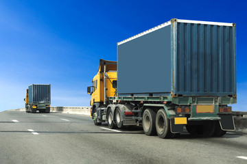 Wall Mural - Truck on highway road with blue container, transportation concept.,import,export logistic industrial Transporting Land transport on asphalt expressway with blue sky