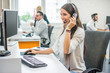 © Bojan - Young smiling operator woman agent with headsets working in a call center.