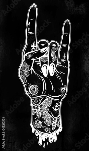 Fotografía Raised inked hand as a rock and roll sign gesture with black nails