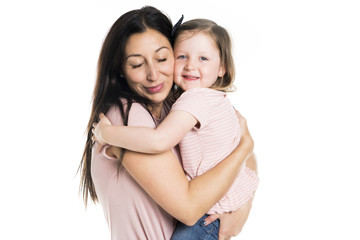 pretty mother standing with her cute daughter