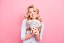 Portrait Of Cute Positive Girl In Casual Outfit Holding Fan Of A Lot Of, Much Money For Shopping In Hands Looking At Camera, Isolated On Pink Background