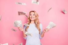 Portrait Of Pretty Charming Positive Cute Successful Lucky Cheerful Girl Standing Under Shower From Money Having A Lot Of Money In Hands Isolated On Pink Background
