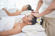 © nareekarn - young woman getting spa treatment at beauty salon. spa face massage. facial beauty treatment. spa salon.