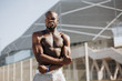 © IVASHstudio - Seductive African American man with muscels poses with naked chest before the fence