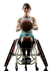 one caucasian young handicapped basket ball player woman in wheelchair sport tudio in silhouette isolated on white background