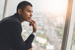 © sutadimages - Businessman Looking out the window and thinking