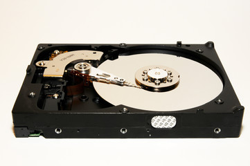 close-up of hard disk opened on wood background