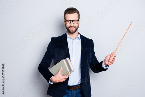 Cuadros en Lienzo Portrait of cheerful teacher with stubble in shirt jacket, having books in hand