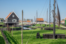Traditional Houses Of A Fishing Village With Nets Drying In The Wind - Enkhuizen, The Netherlands