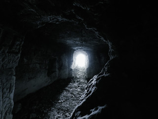 ansient dark stone cave whith letters inside view