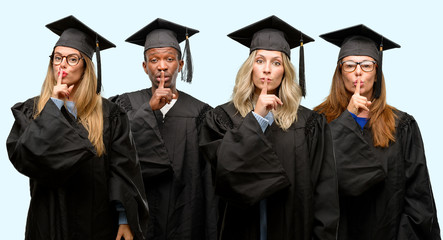 Poster - Education concept, university graduate woman and man group with index finger on lips, ask to be quiet. Silence and secret concept