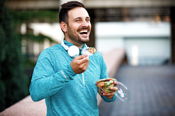 man is eating vegetable salad
