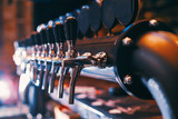 Fototapeta  - Beer tap array in beer bar