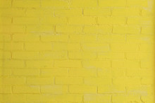 Yellow Painted Brick Wall As A Background Or Backdrop