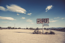 A dilapidated, classic, vintage motel sign in the desert of Arizona