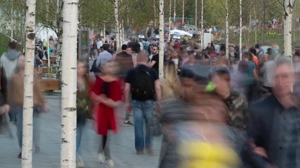 Wall Mural - Movement of crowd in a city park timelapse motion