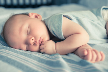 Wall Mural - Cute baby boy sleeping. 