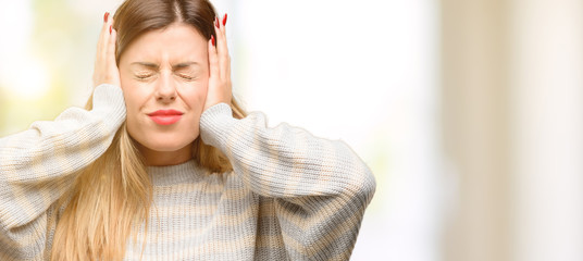 Sticker - Young beautiful woman covering ears ignoring annoying loud noise, plugs ears to avoid hearing sound. Noisy music is a problem.