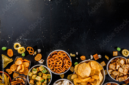 Cuadros en Lienzo Variation different unhealthy snacks crackers, sweet salted popcorn, tortillas,