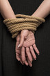 © Adam Radosavljevic - Hands on back tied with a rope