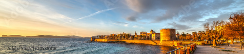 Leinwand Poster  Panoramic view of Alghero at sunset