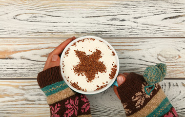 Wall Mural - Woman hands hold full latte cappuccino coffee cup