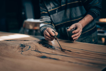 Poster - treatment of wood with varnish, epoxy, paint. manual manufacturing of furniture from solid .