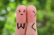 Fingers art of displeased couple. Woman was offended, man asks her forgiveness.