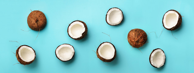 Wall Mural - pattern with ripe coconuts on blue background. top view. copy space. pop art design, creative summer