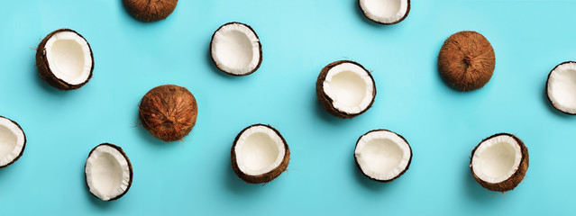 Wall Mural - pattern with ripe coconuts on blue background. top view. copy space. pop art design, creative summer