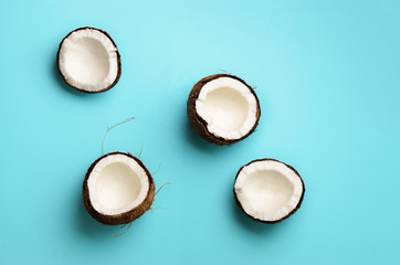 Wall Mural - pattern with ripe coconuts on blue background. top view. copy space. pop art design, creative summer