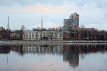 Wall Mural - houses with reflection on the river embankment