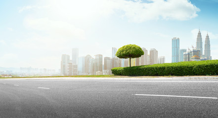 Wall Mural - Empty asphalt road with modern city skyline .