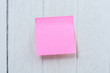Many colorful sticky note, post note on white wooden vintage background