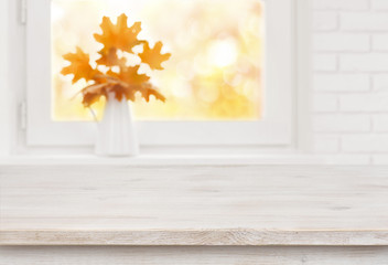 Wall Mural - Bleached wooden table on the background of white autumn windowsill