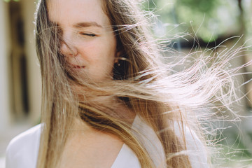 Portrait of happy beautiful woman with long hair, closeup