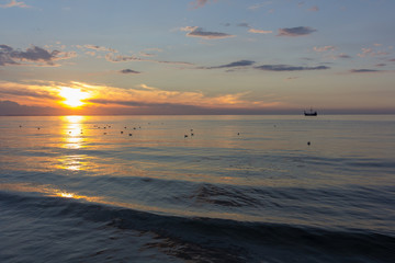 Poster - Ship in the sea at sunset