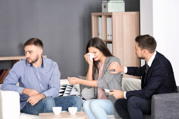 Wall Mural - Psychologist working with married couple in office