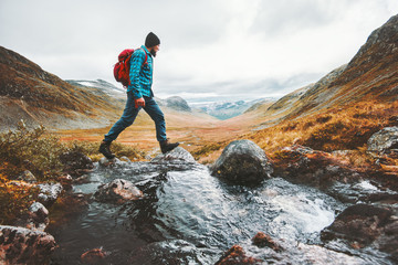 man solo traveling backpacker hiking in scandinavian mountains active healthy lifestyle adventure jo
