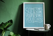 © Rawpixel.com - A motivation typography print on the desk against the green wall