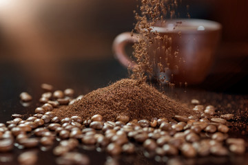 Seeds of coffee close up on a black background. ground coffee