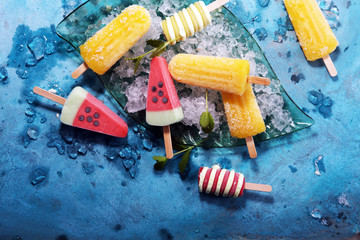 Poster - Colorful popsicle or Vanilla frozen yogurt or soft ice cream.