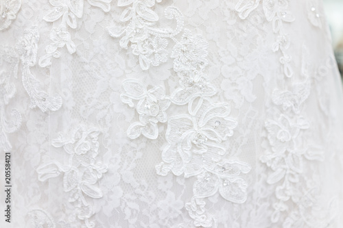 Valokuva Macro closeup of lace wedding dress veil material, white garment textile with sh