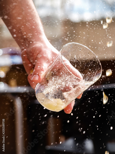 Cuadros en Lienzo Man hand holding a glass of asturian, spanish apple cider