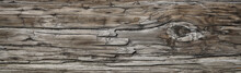 Old Dark Rough Wood Floor Or Surface With Splinters And Knots. Square Background With Flooring Or Boards With Wood Grain. Old Aged Timber In A Barn Or Old House.