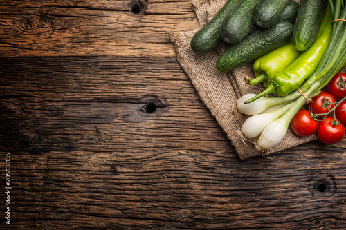 Stampe Fresh vegetable onion cucumber pepper and tomatoes on rustic oak table