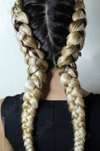 Two Braids On The Head Of A Girl With A Kanekalon Thick